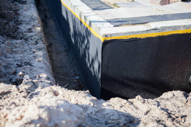 Professional Basement Waterproofing technician working in Dayton, OH